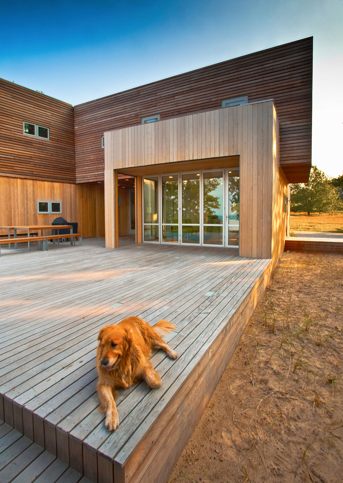 Wooden deck of the sustainable lake house project in Omena, Michigan designed by the architecture studio Danny Forster & Architecture