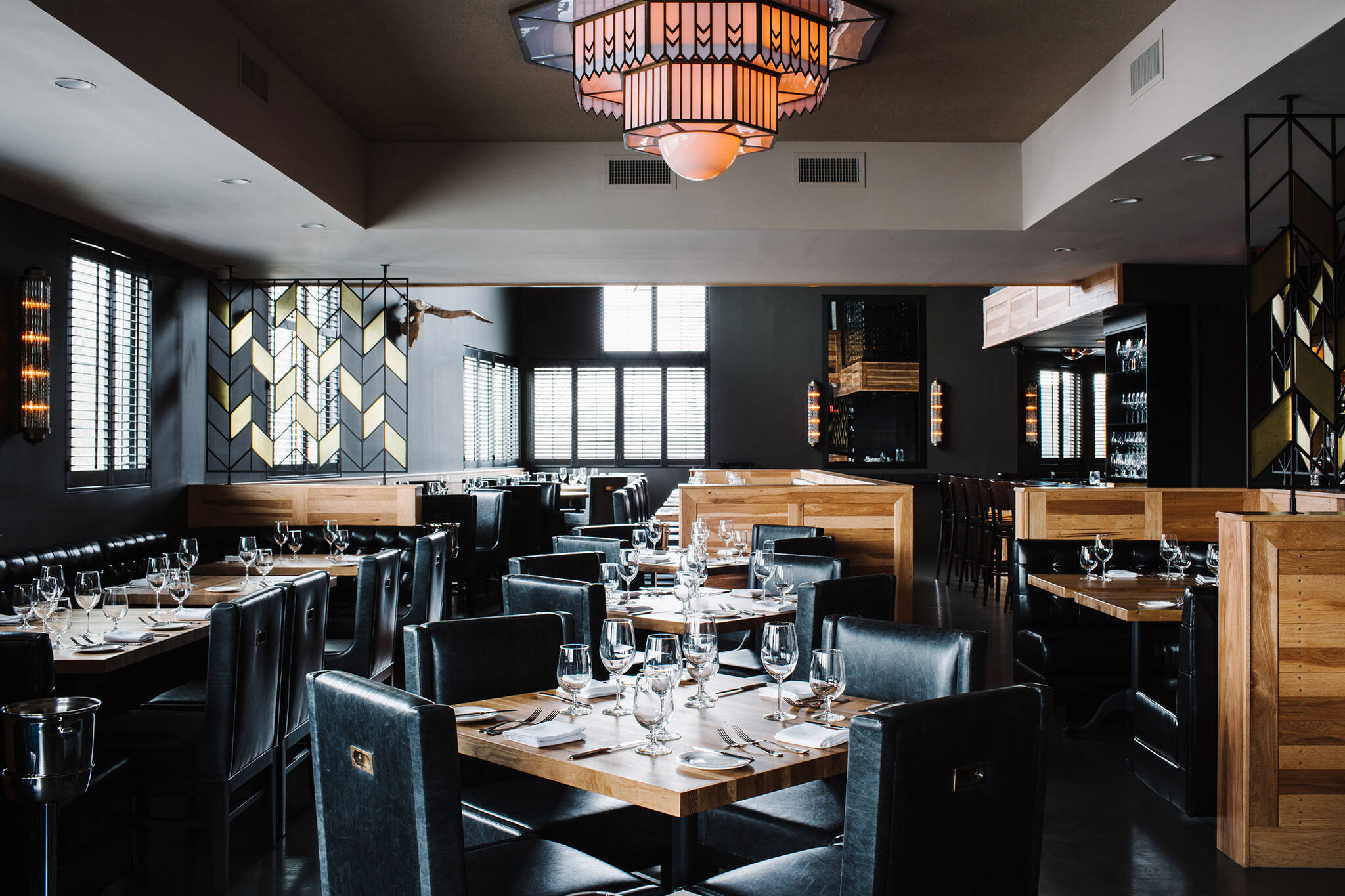 Intimate dining area of the American Cut Bar & Grill project located at 495 Sylvan Avenue in Englewood Cliffs, New Jersey designed by the architecture studio Danny Forster & Architecture