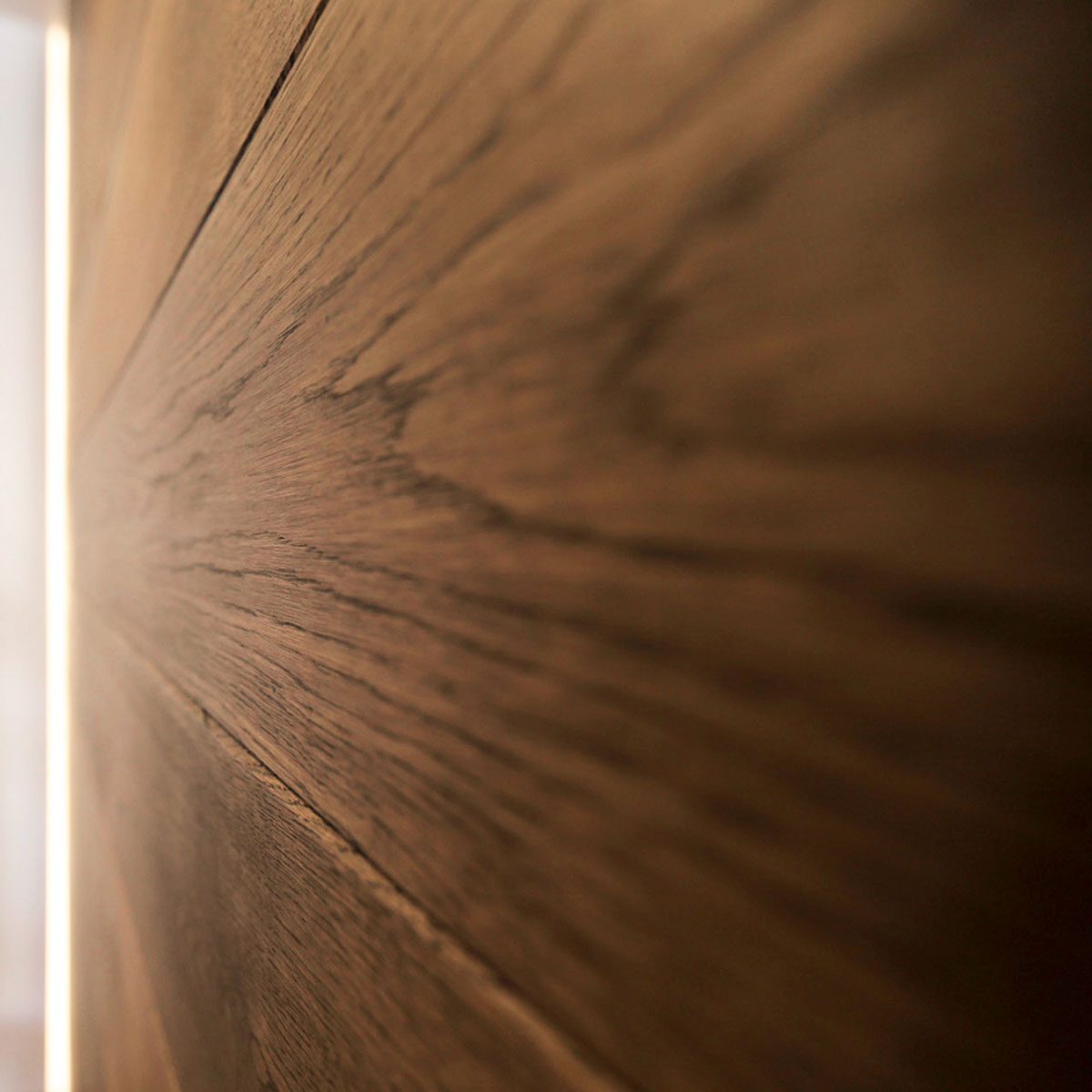 Wood grain detail of the sliding doors that divide the living room and the bedroom of the residence renovation project in the Chelsea Mews building on the Flatiron District in Manhattan, New York City designed by the architecture studio Danny Forster & Architecture