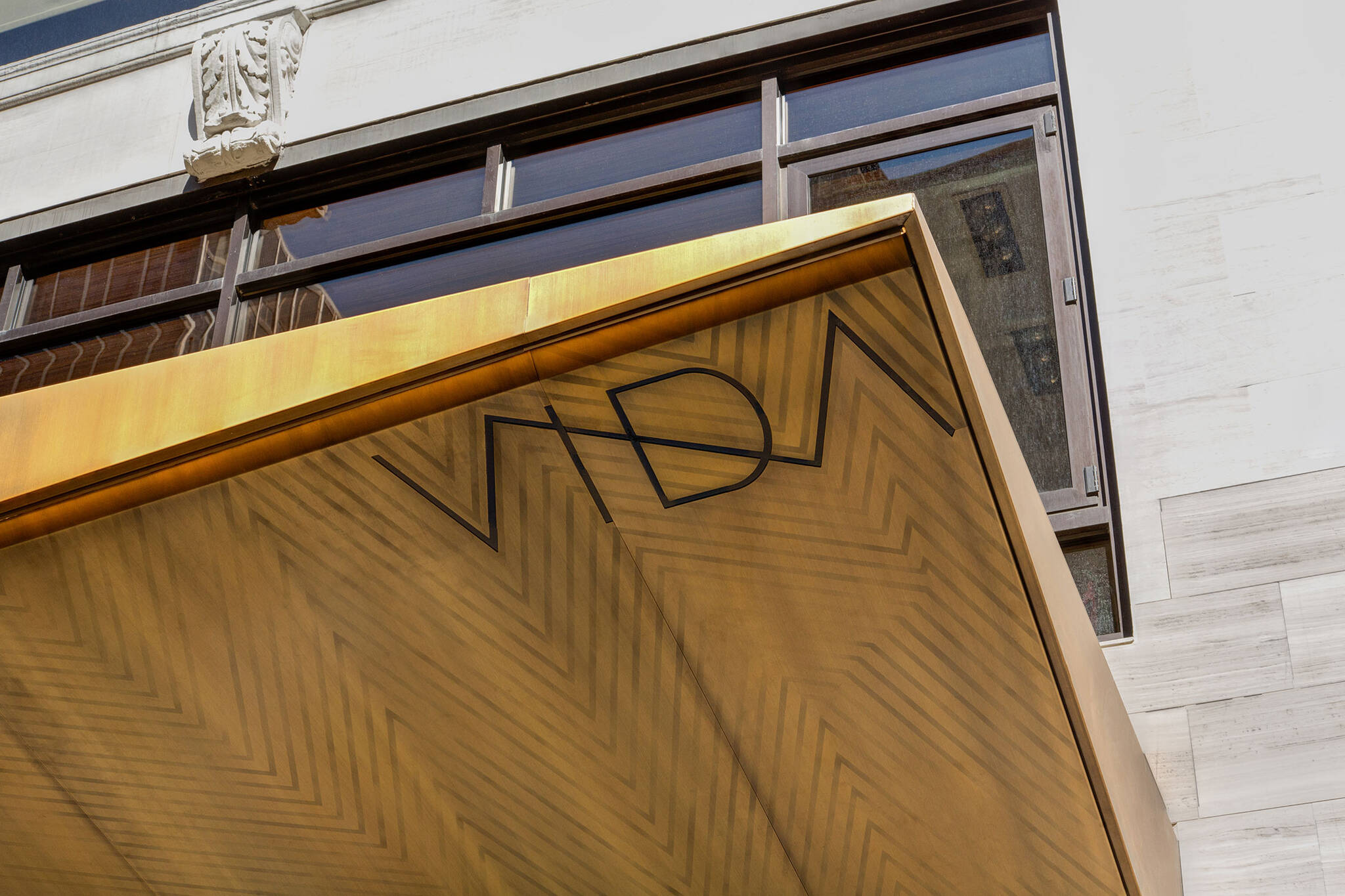 Branding on the corner of the Vida Shoes International canopy project for the shop located at 29 West 56th Street in Midtown, New York City designed by the architecture studio Danny Forster & Architecture